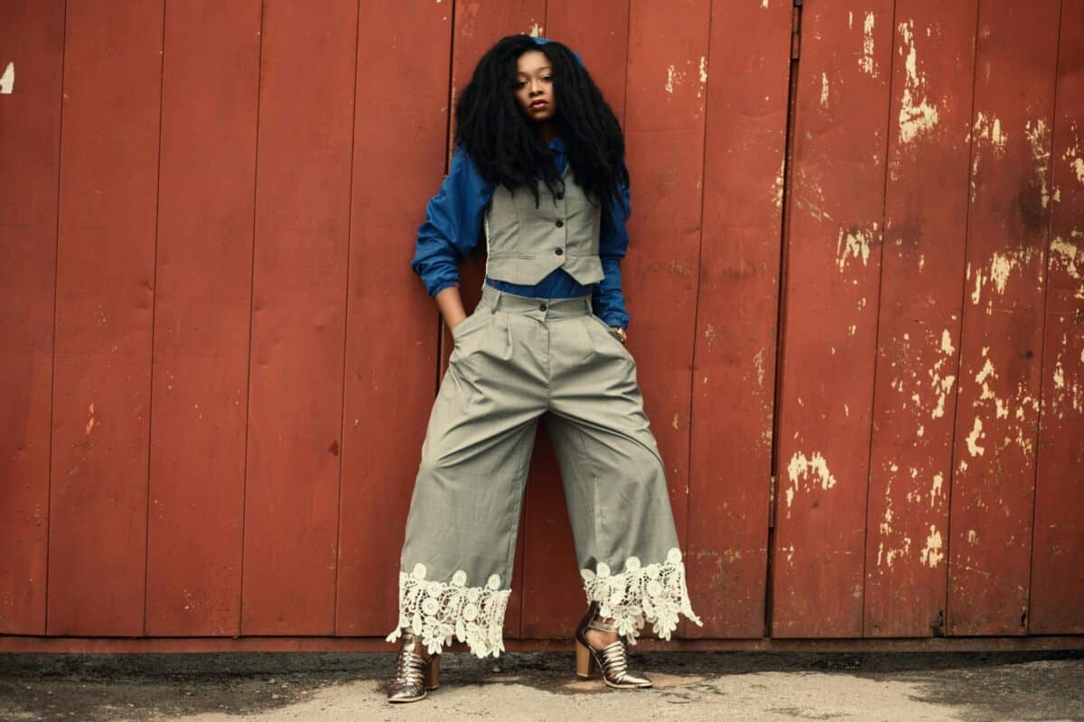 Woman wearing grey Zoot suit style trousers with waistcoat