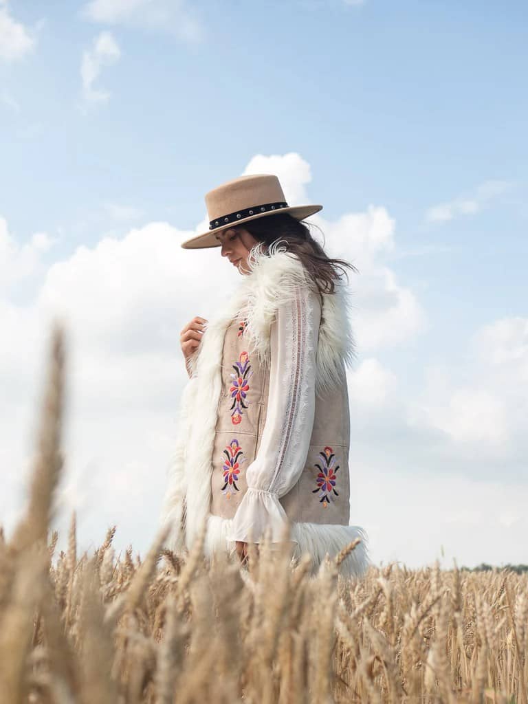 Afghan Waistcoat worn by woman in a field made by dandelie 