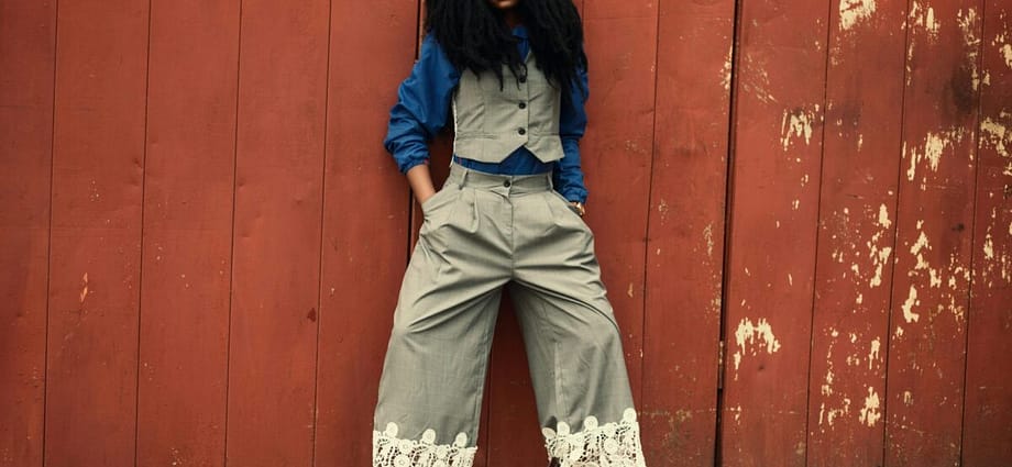 Woman wearing grey Zoot suit style trousers with waistcoat